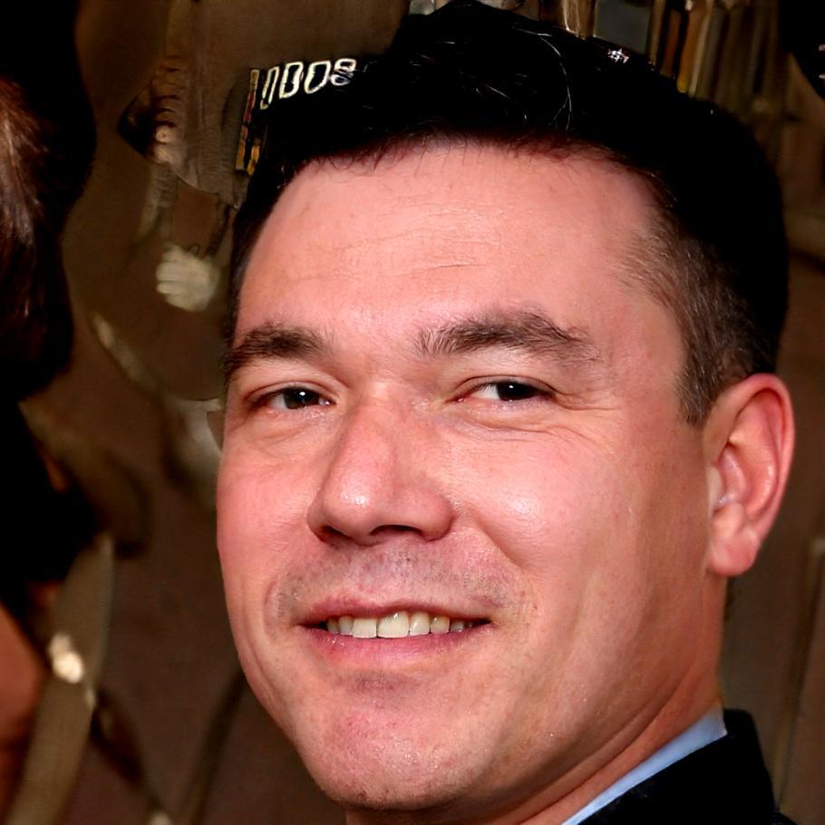 Senior financial analyst Marcus reviewing client portfolio